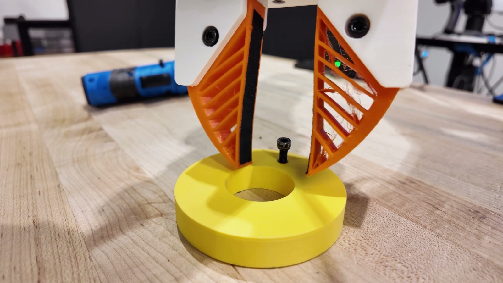 Flex-π · robot gripper performing a contact-rich manipulation task